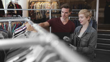 Millennial couple in a vintage clothing store