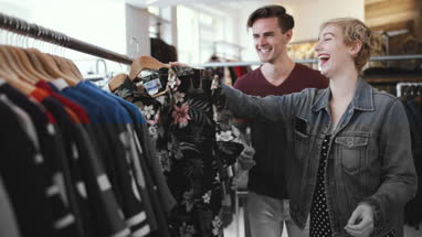Millennial couple in a vintage clothing store