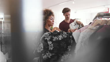Millennial couple in a vintage clothing store