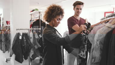 Millennial couple in a vintage clothing store