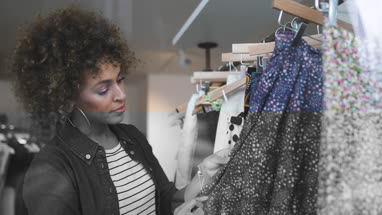 Young adult female clothes shopping