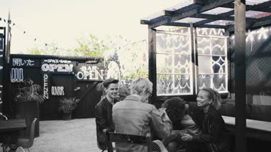 Friends socialising outdoors in summer