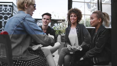 Friends socialising outdoors in summer