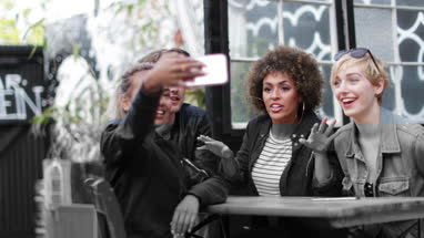 Friends socialising outdoors in summer