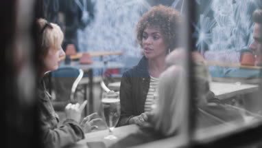 Friends drinking in an outdoor bar in summer