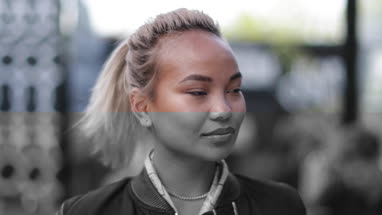 Portrait of Millennial female outdoors