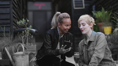 Friends socialising outdoors in summer