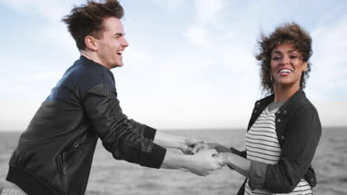 Friends on the beach in evening light