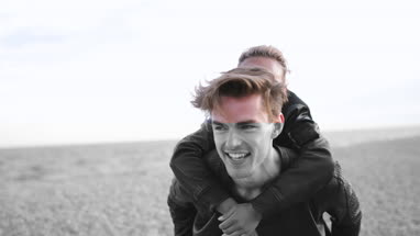 Excited friends on the beach 