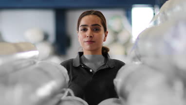 Portrait of female employee in distribution warehouse