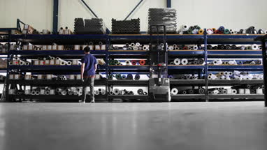 Male looking for item in distribution warehouse