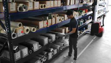 Male looking for item in distribution warehouse