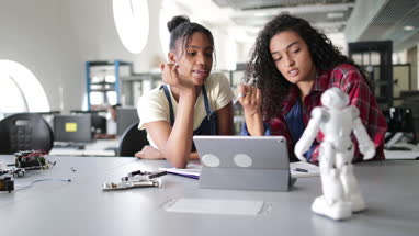High school students working on robotics in class