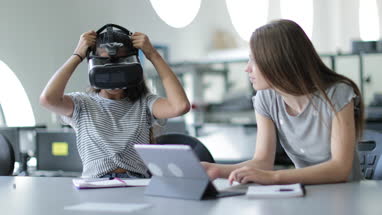 High school students using VR headset in class
