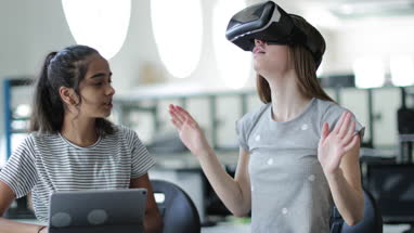 High school students using VR headset in class