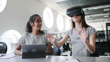 High school students using VR headset in class