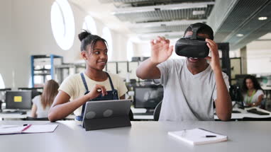 High school students using VR headset in class