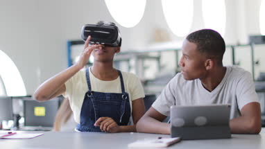 High school students using VR headset in class