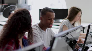 Students learning how to code in class