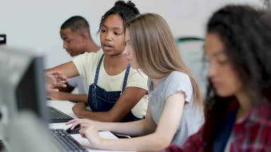Students working together in a computer science class