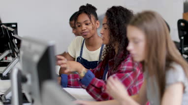 Students working together in a computer science class