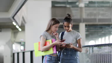 Students looking at smartphones at break time