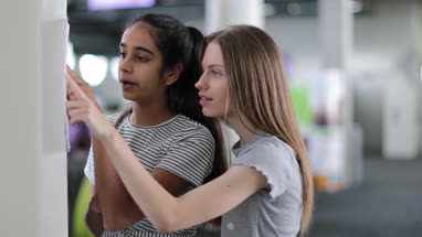 High school students checking results on board
