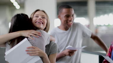 High school students opening their exam results