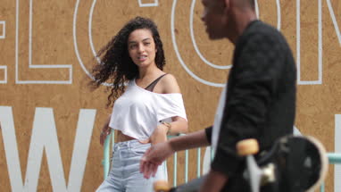 Teenagers socialising outdoors in city