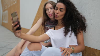 Female teenage friends taking a selfie