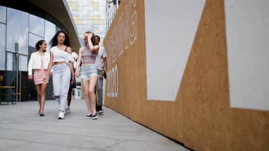 Group of teenagers walking through city