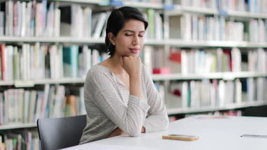 Portrait Arabic female in library