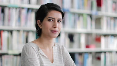 Portrait Arabic female in library