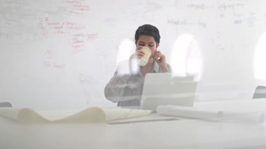 Arabic businesswoman working on laptop drinking coffee