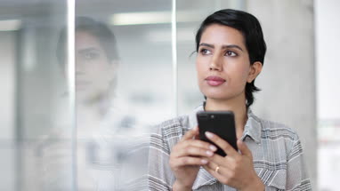 Arabic businesswoman using a smartphone in an office