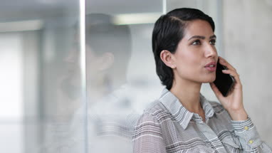 Arabic businesswoman using a smartphone in an office