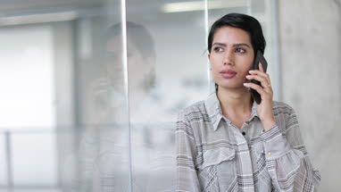 Arabic businesswoman using a smartphone in an office
