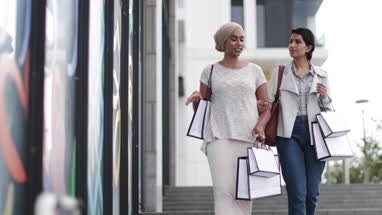 Muslim friends shopping together outdoors