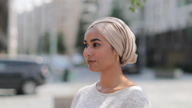 Portrait of Muslim woman on city street