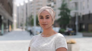 Portrait of Muslim woman on city street