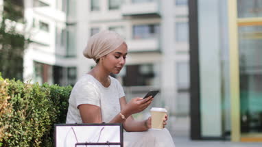 Muslim female having coffee on a shopping trip