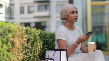 Muslim female having coffee on a shopping trip