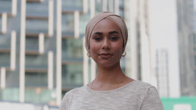 Portrait of Muslim woman on city street