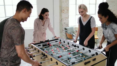 Friends playing table football