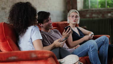 Millennials watching video on smartphone together