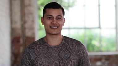 Portrait of millennial male in creative office