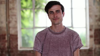 Portrait of millennial male in creative office