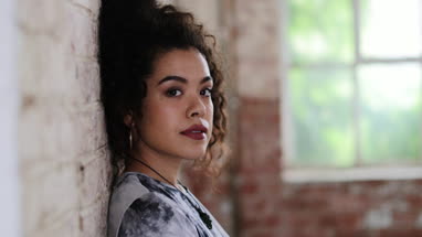 Portrait of millennial female in creative office