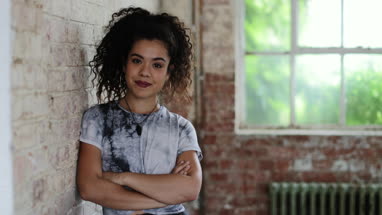 Portrait of millennial female in creative office