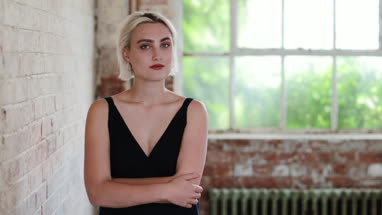 Portrait of millennial female in creative office